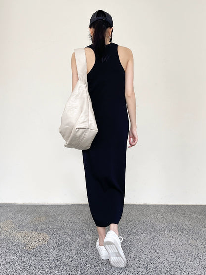A slimming A-shaped long dress with a black tank top skirt that holds in the waist 