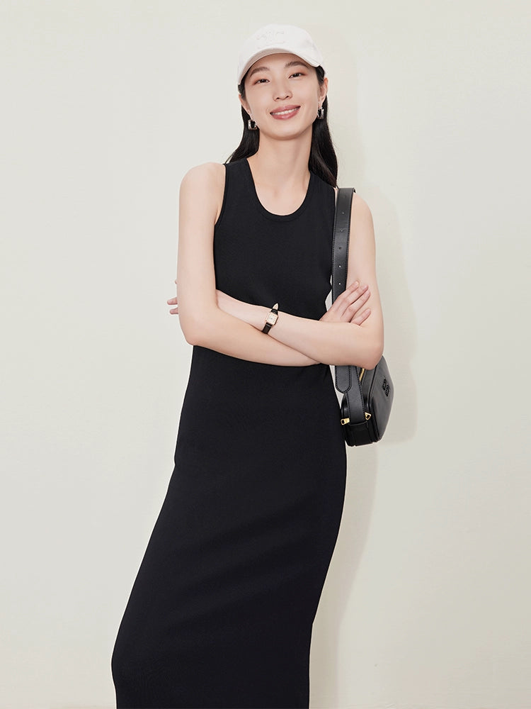 A slimming A-shaped long dress with a black tank top skirt that holds in the waist 